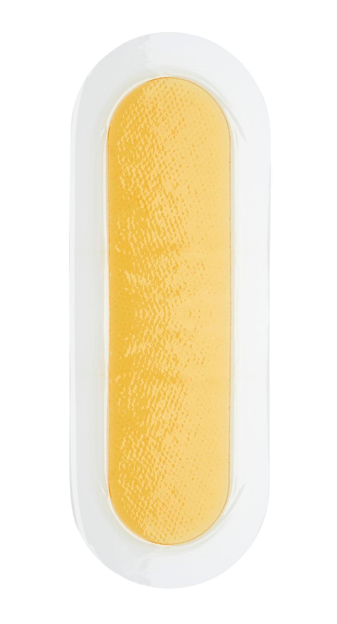 medical product photography of gold color adhesive medical device product on white background