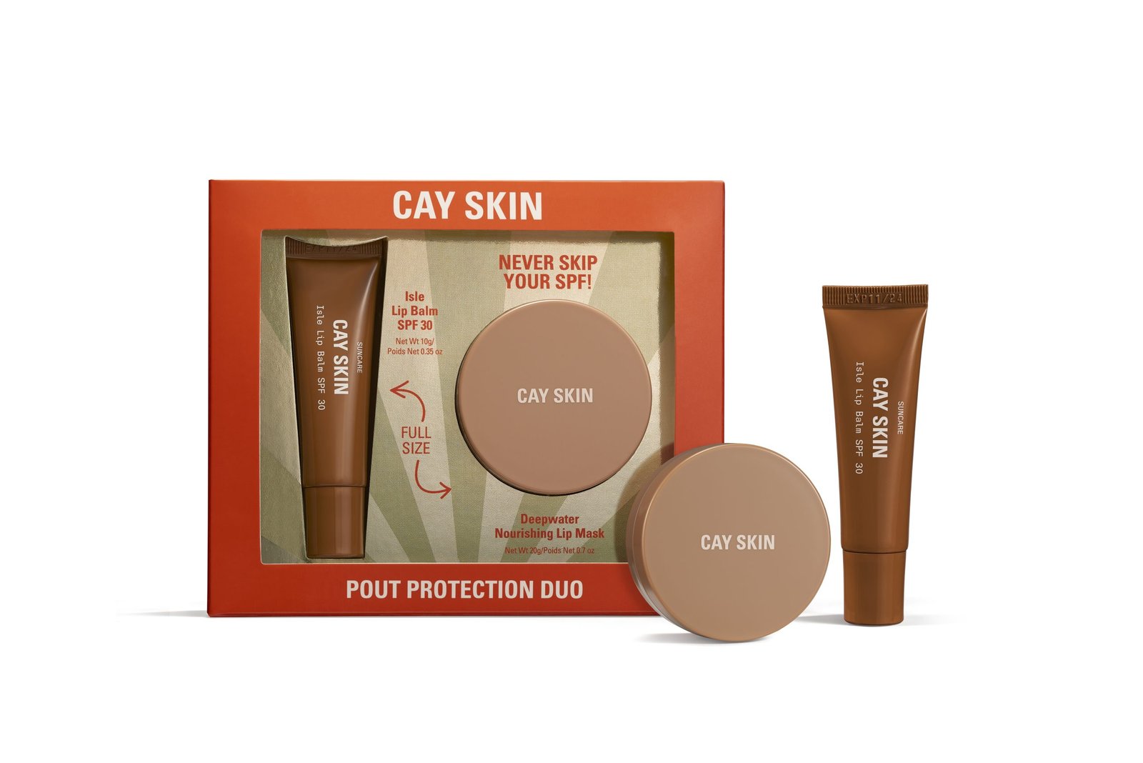 product photography on white surface of red and gold gift box with lip and skincare cosmetics