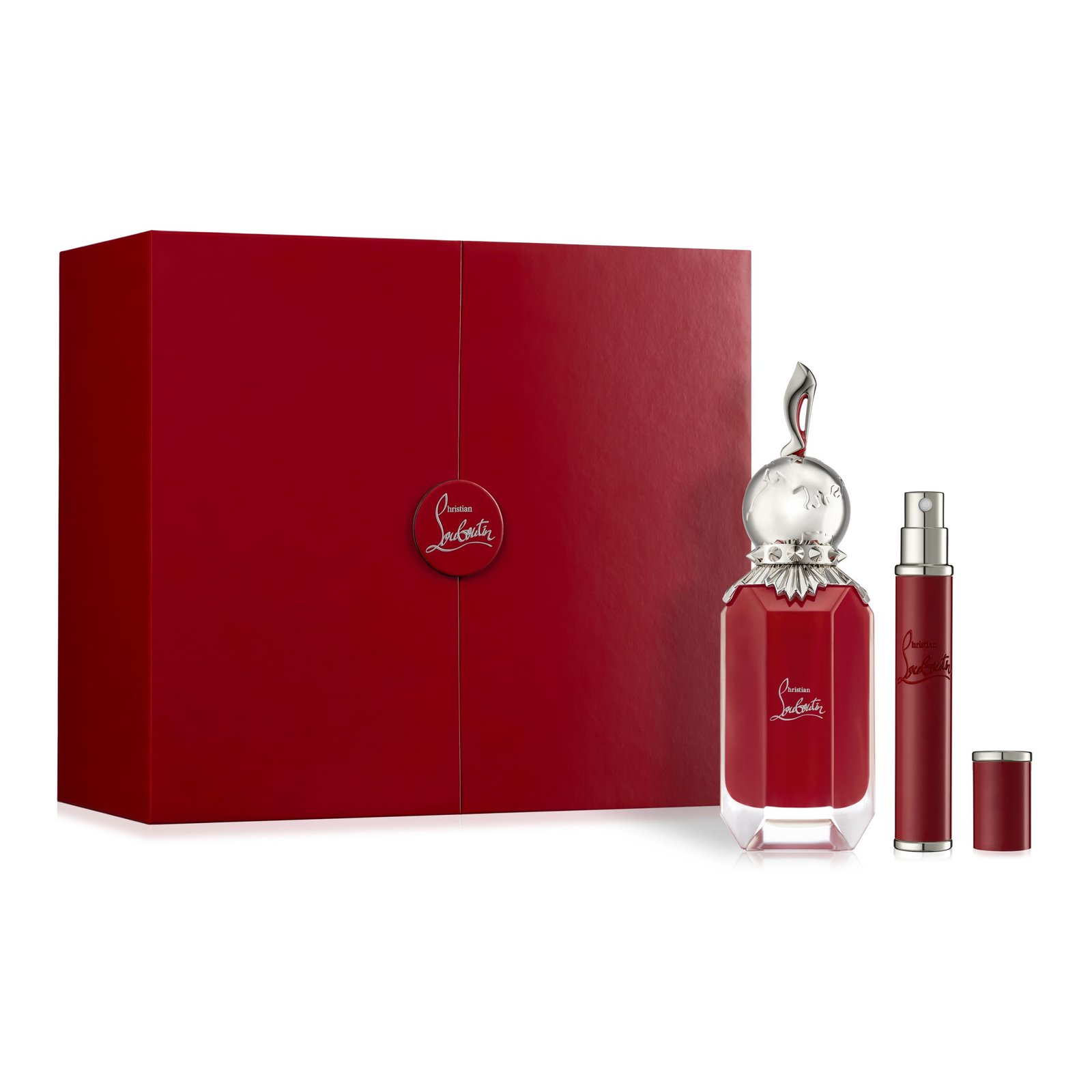 product photography on white surface of red perfume bottle and lipstick with red gift box shadow