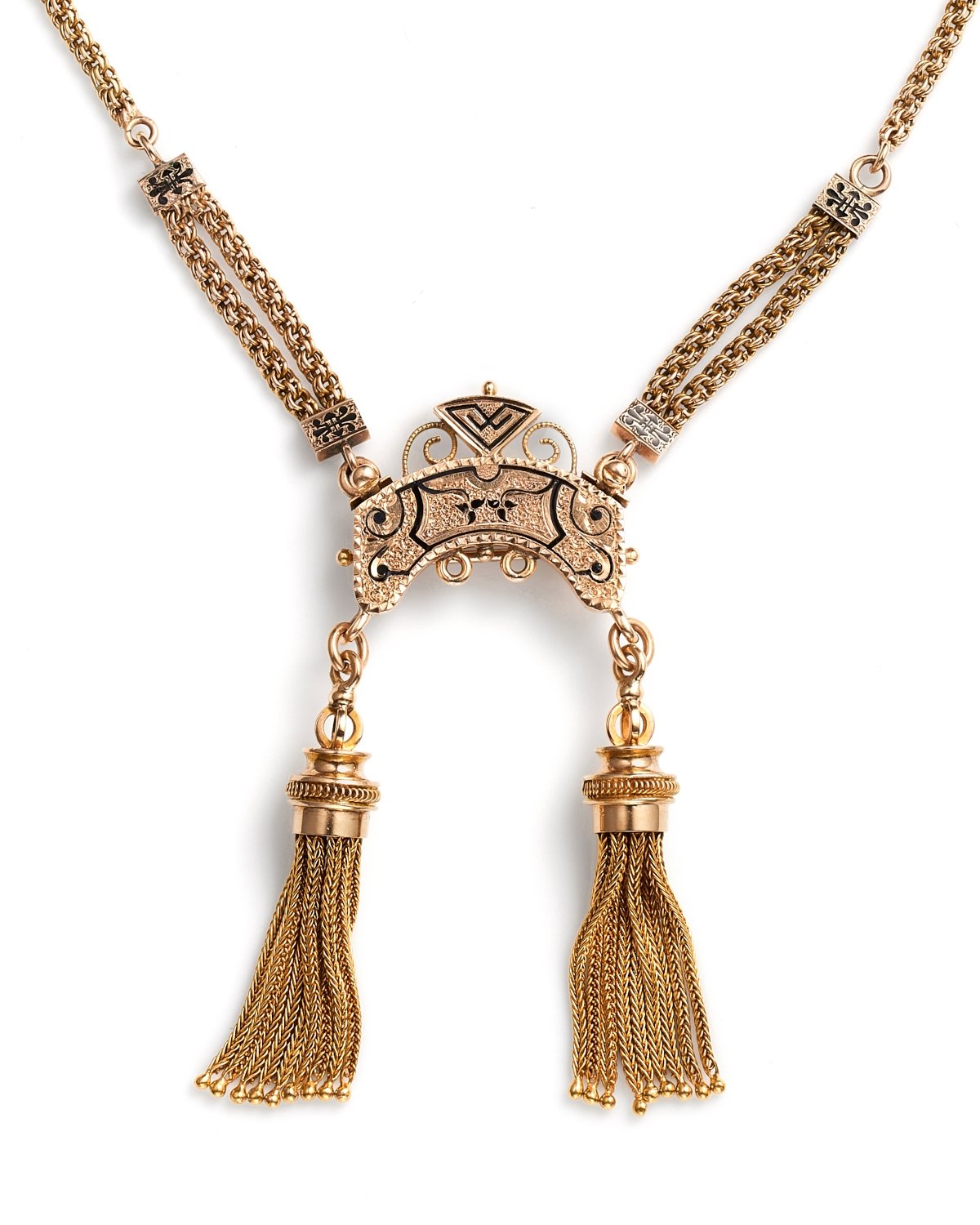 Product photography on white surface of gold necklace