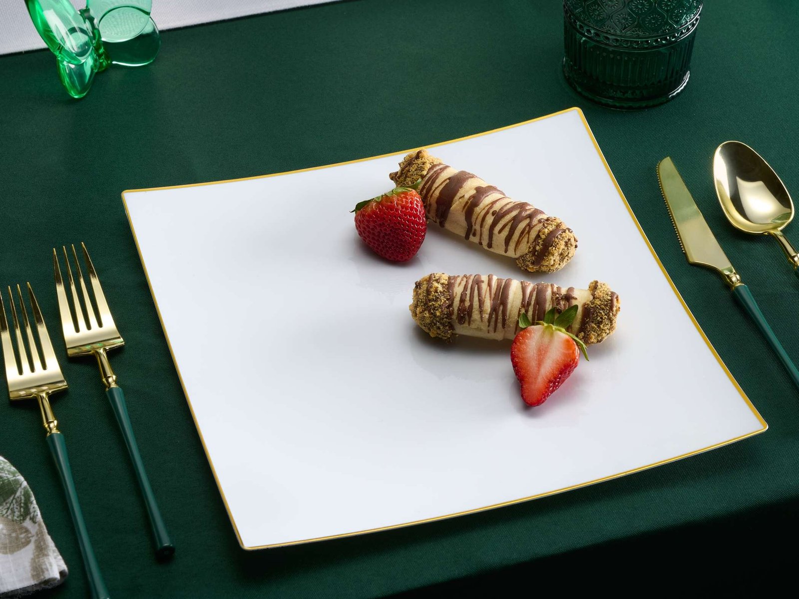 product lifestyle photography of white dinner plate setting with chocolate cannoli and strawberries on plate