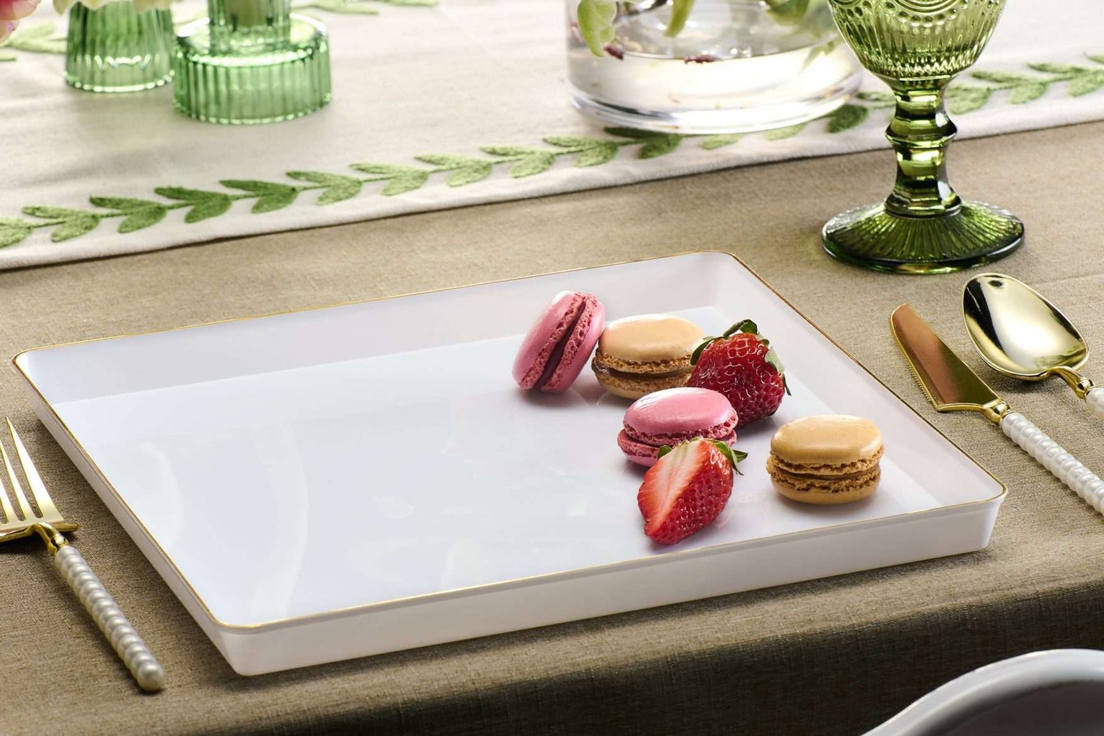 product lifestyle photography of white dinner plate setting with a multi colored macaroon cookies on plates